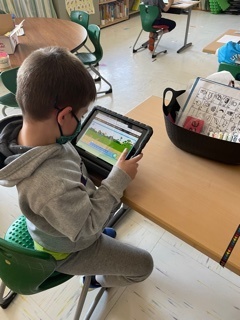 K student checking out his coding